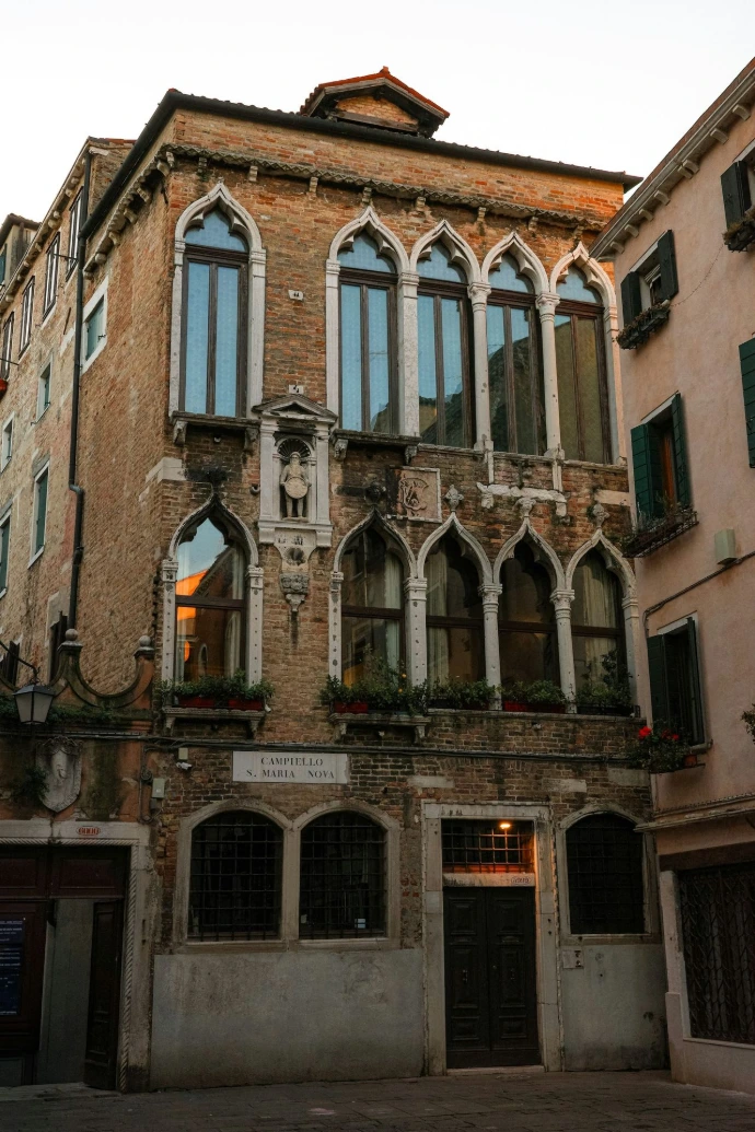 Old brick building with arched windows in venice